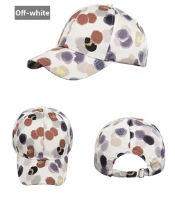 Detailed three-way view of off-white baseball cap with modern abstract floral patterns