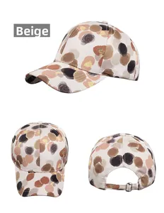 Multiple views of beige baseball cap featuring artistic brown abstract floral print patterns