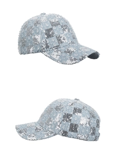 Detail of blue denim baseball cap with silver sequins and distressed retro texture