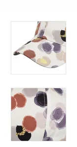 Detailed macro view of beige baseball cap with purple floral patterns and gold glitter accents
