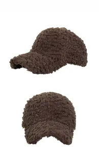 Detail views of brown faux shearling baseball cap showing soft texture and curved brim