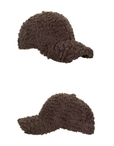 Close-up detail showing the thick brown lamb wool texture of the winter baseball cap