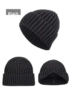 Detailed macro view of black rib-knit winter beanie showing thick texture and inner lining