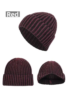 Detailed macro view of the thick burgundy and black ribbed knit pattern on the beanie