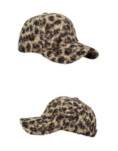 Detail of leopard print baseball cap with thick teddy fleece texture and warm fabric