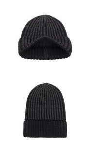 Detail view of the thick ribbed knit texture and wide folded cuff on this warm winter beanie
