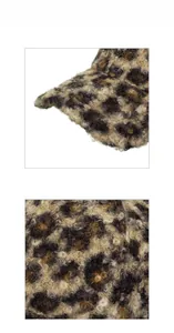 Close-up of leopard print teddy fleece fabric texture on a winter baseball cap