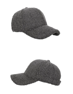 Detail of grey plush faux fur fabric texture on a minimalist winter baseball cap