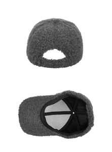 Detail of dark grey plush baseball cap showing fleece texture and inner cotton lining