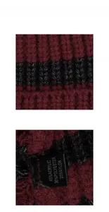 Detail of red and black striped knit fabric with washing label showing material composition