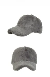 Detail view of plush faux mink fur texture on grey winter baseball cap for women
