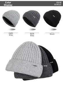 Detailed color display of grey and black ribbed knit winter beanies with metal logo tag