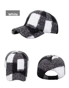 Detail view of plush black and white checkered baseball cap showing fabric texture