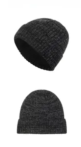 Detail of dark grey striped knit beanie with warm fleece lining and ear protection flap