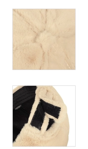 Detail showing the adjustable black velcro strap and soft plush texture of the beige winter cap