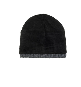 Detailed view of winter beanie featuring black wool fabric and grey ribbed knit brim texture
