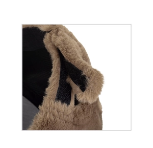 Macro shot of fluffy brown faux fur texture and black velcro strap on winter warm hat