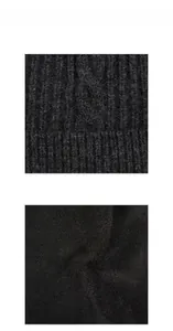 Dettaglio del cappello di lana da uomo con motivo a trecce e fodera in pile spessa