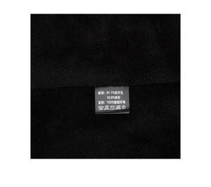 Detail of wool blend fabric and care label showing 81.1% sheep wool and 18.9% nylon content