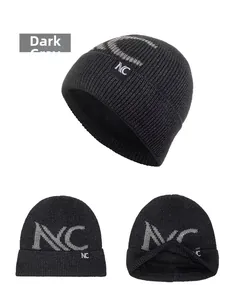 Detail of dark grey knit beanie with thick fleece lining and NC embroidered logo pattern