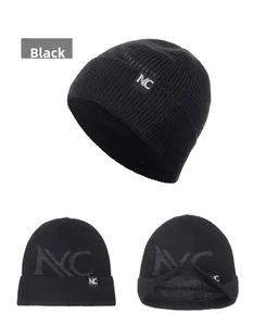 Detail of black knit beanie with NC label and thick fleece lining for winter warmth