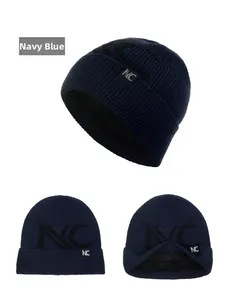 Detail view of navy blue ribbed knit beanie with thick fleece lining and NC logo