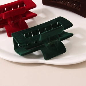 Retro 8.5cm flocked square hair claws in red, green and brown on a ceramic tray