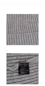 Close-up showing grey knit fabric texture and material care label with acrylic nylon blend