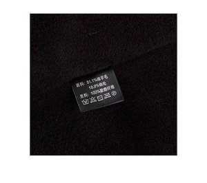 Close-up of wool knit fabric with care label showing 81.1% sheep wool composition