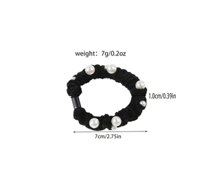 Detailed size view of black velvet scrunchie with white pearls showing 7cm diameter
