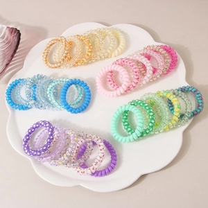 Lot de 30 élastiques spirales colorés pour cheveux avec divers motifs de fleurs et d'étoiles