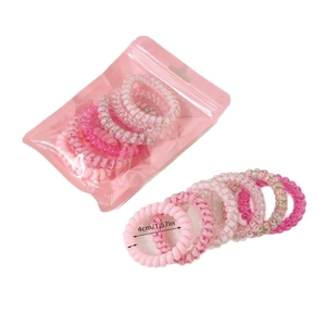 Lot de 6 chouchous spirales roses de 4cm de diamètre dans une pochette zippée transparente