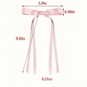 Pink ribbon bow hair clip with long streamers and detailed size measurements shown