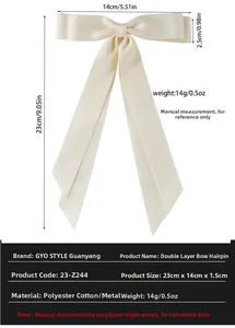 Detailed view of cream double-layered ribbon hair clip with 23cm length dimensions