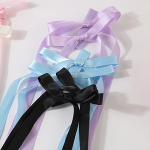 Elegant satin bow hair clips with long streamers in multiple pastel colors