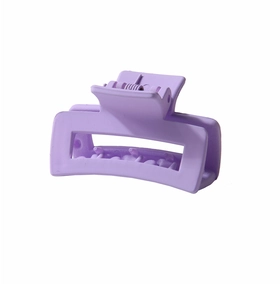 Macro shot of purple matte rectangular hair claw clip with high-elastic metal spring