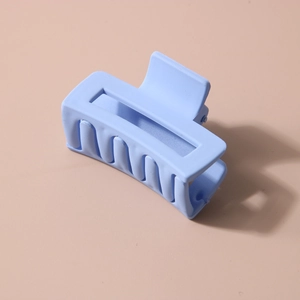 Matte candy-colored rectangular hair claw clip in pale blue for stylish hair styling