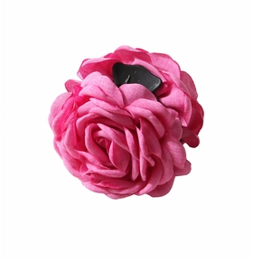 Close-up of pink fabric rose hair claw clip with detailed petal texture and black grip