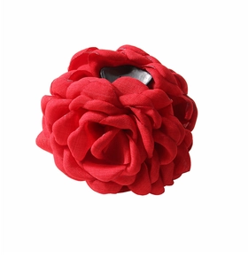 Detailed close-up of large red fabric rose flower hair claw clip with layered petals