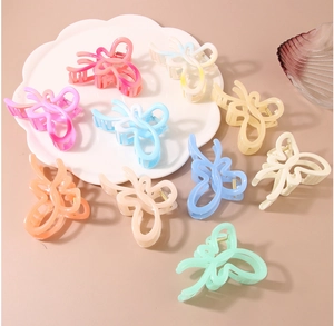 Collection of colorful butterfly hair claws in matte finish with a metal spring mechanism