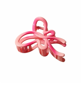 Detailed top view of a large pink gradient butterfly hair claw clip with glossy finish