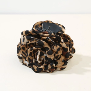 Detail of leopard print rose hair claw clip with chiffon fabric petals and black grip