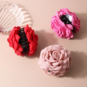 Three large fabric rose flower hair claw clips in red and shades of pink for women