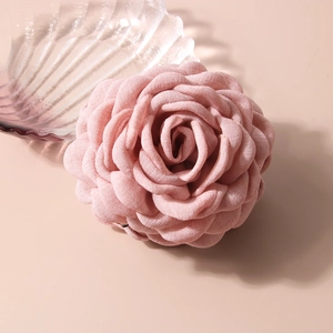 Pink fabric rose flower hair claw clip with layered petals for elegant hair styling