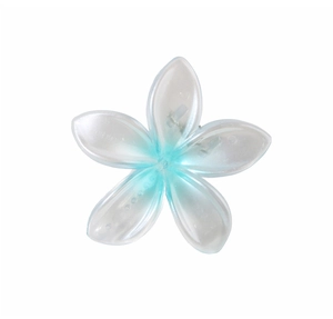 Detailed close-up of blue and white gradient plumeria flower hair clip with pearlescent finish