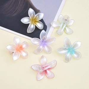 Pearlescent floral hair clips set in six gradient colors with a glossy resin finish