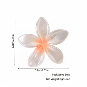 Pearlescent flower hair clip with 6.5cm diameter in pink-orange gradient resin finish