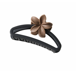Detail of matte black semi-circle hair claw clip with a 3D coffee flower ornament