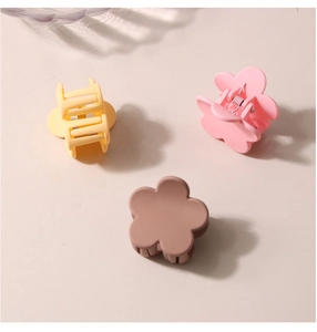 Three-piece set of matte flower hair clips in yellow, pink and brown colors