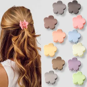 Matte flower hair claws in macaron colors shown on model and in product array